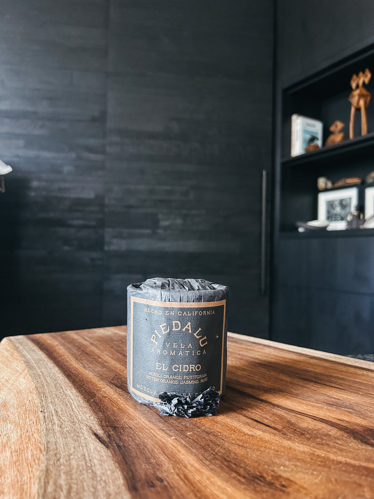 The El Cidro candle by Piedalu featuring notes of neroli, orange, petitgrain, bitter orange, and jasmine rose.