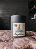 A hand-poured candle inspired by carefree days spent outdoors, featuring notes of cannabis flower, redwood, vetiver, and billowing smoke.