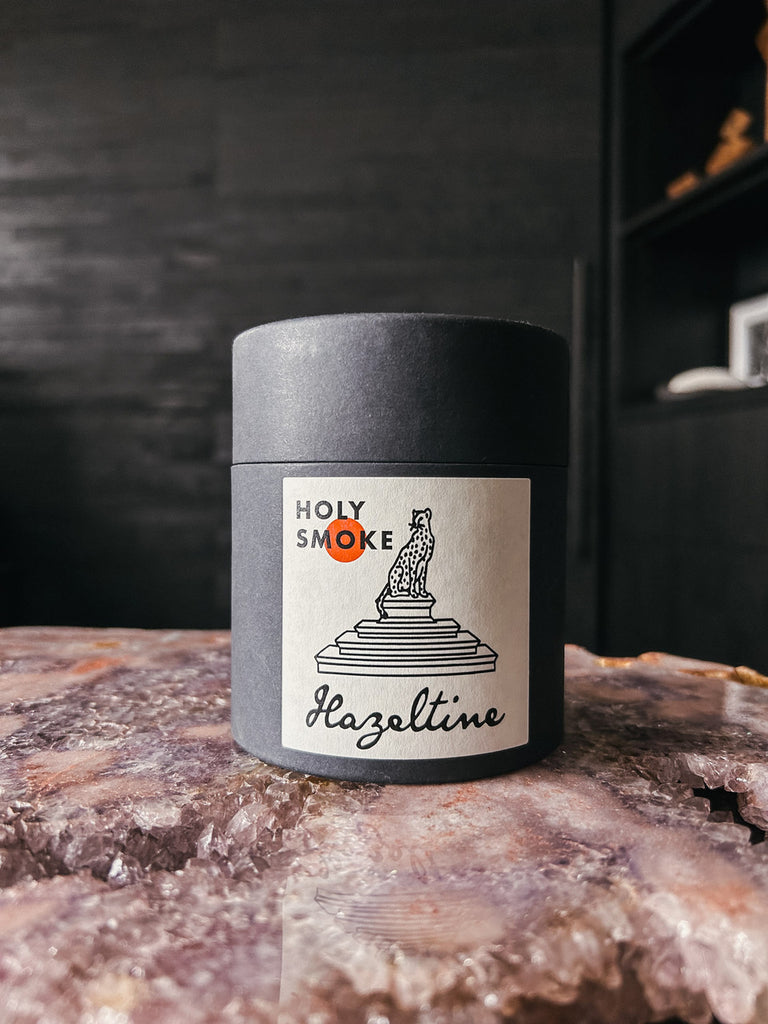 A hand-poured candle inspired by carefree days spent outdoors, featuring notes of cannabis flower, redwood, vetiver, and billowing smoke.