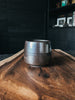 The handcrafted Holland Cup by Fenway Clayworks in the color Onyx.