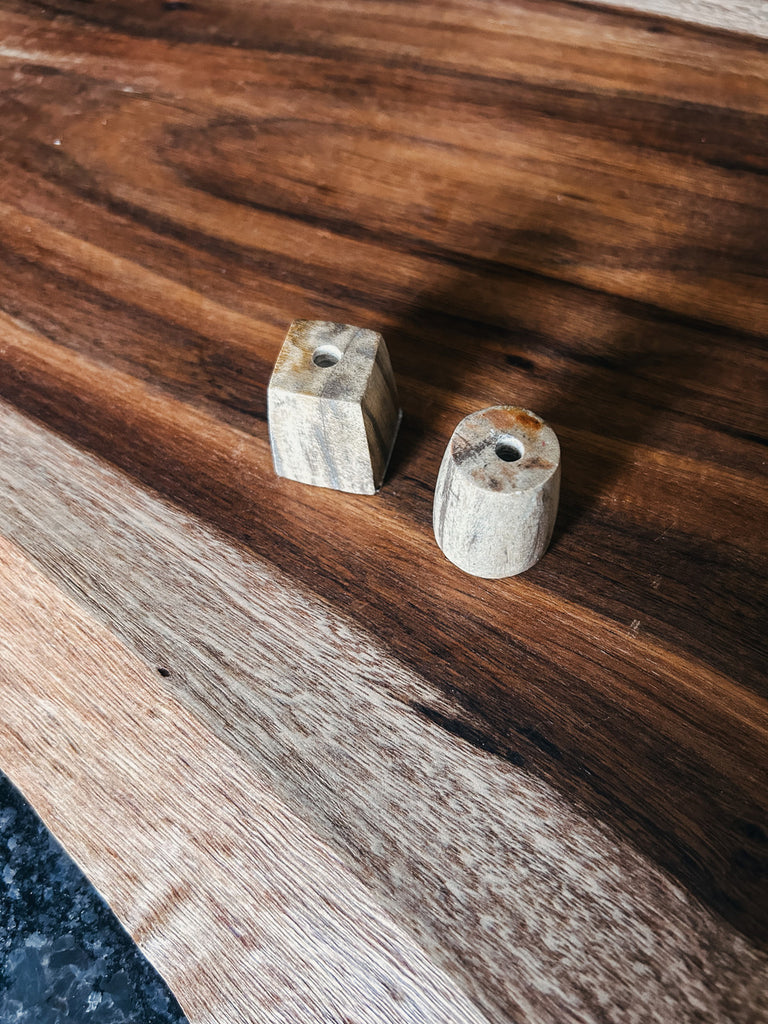 Polished petrified wood holder for incense sticks.