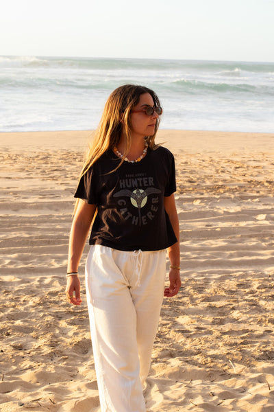 A lightweight, breathable cropped tee with a unique Hunter Gatherer design printed on the front.