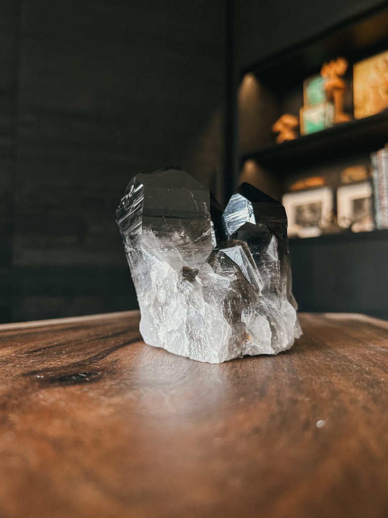 An Arkansas Smoky Quartz Cluster, this powerful and grounding stone is known for its protective and healing properties.