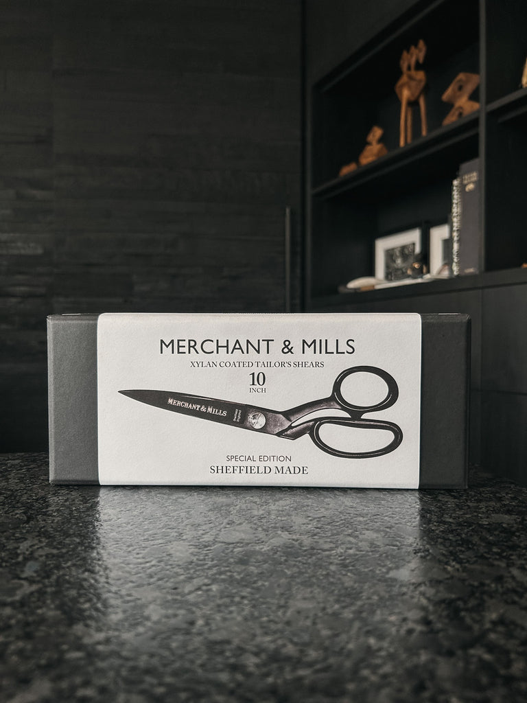 A pair of matte black 10-inch shears by Merchant & Mills, crafted in Sheffield and coated in non-stick Xylan for smooth, precise fabric cutting.