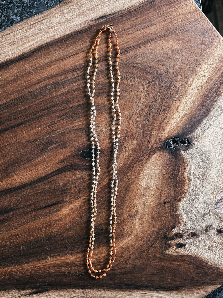 A beautiful and elegant necklace of faceted Mexican fire opals in fiery shades of red, orange, yellow, white, and clear.