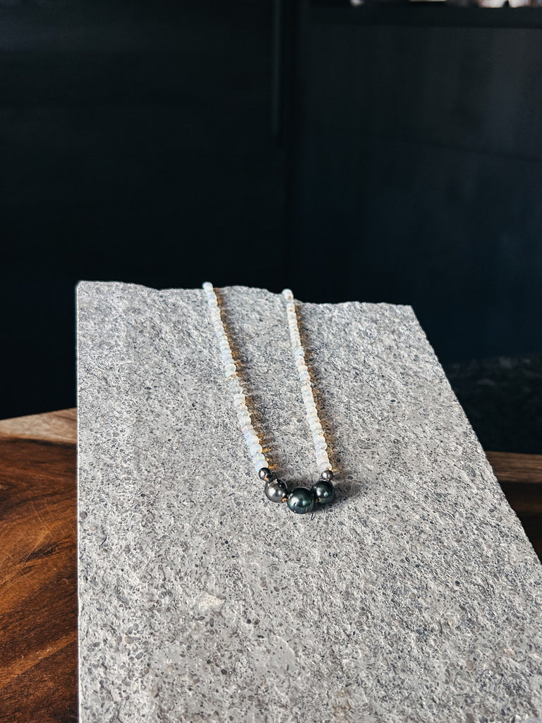 An opal necklace featuring five Tahitian pearls, made in Hawaii by Patrick Spier.