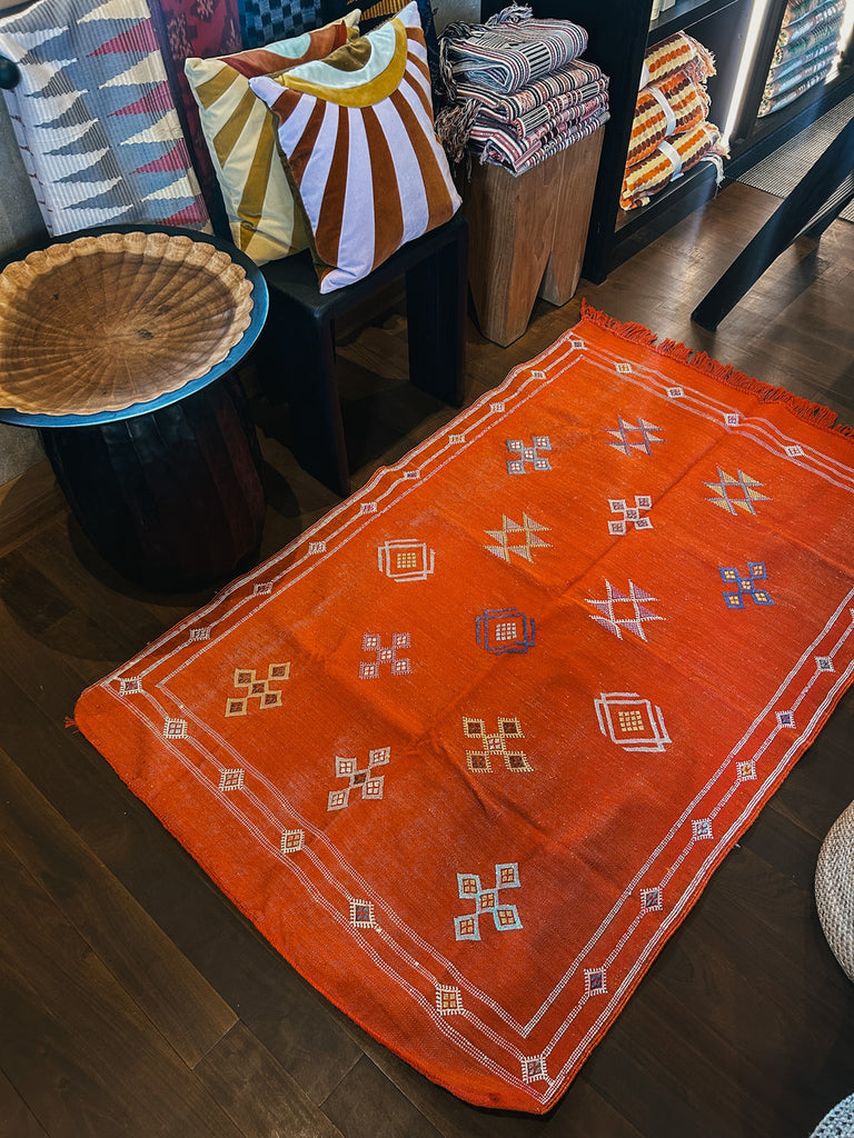 Orange cactus silk rug.