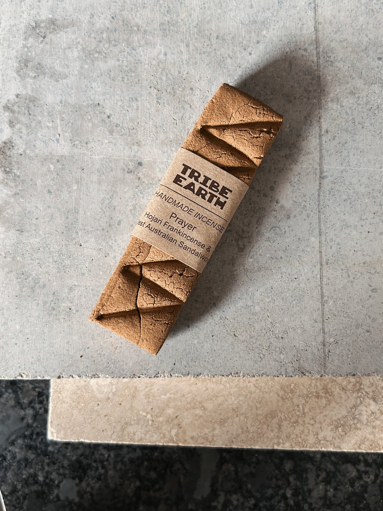 A handmade incense stick crafted from sandalwood and Hojari frankincense by Tribe Earth.