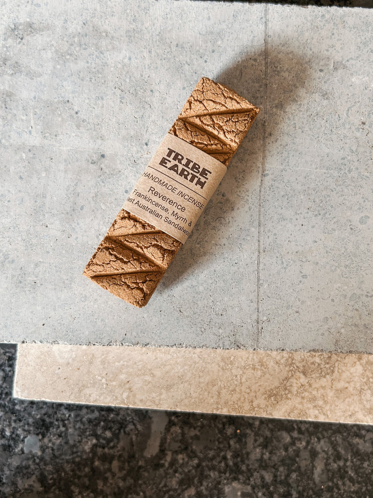 A handmade incense stick crafted from frankincense, myrrh, and West Australian sandalwood by Tribe Earth.