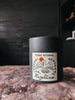 A hand-poured candle inspired by shaded desert sanctuaries, featuring notes of rosewater, fig leaf, cedarwood, and sun-warmed earth.