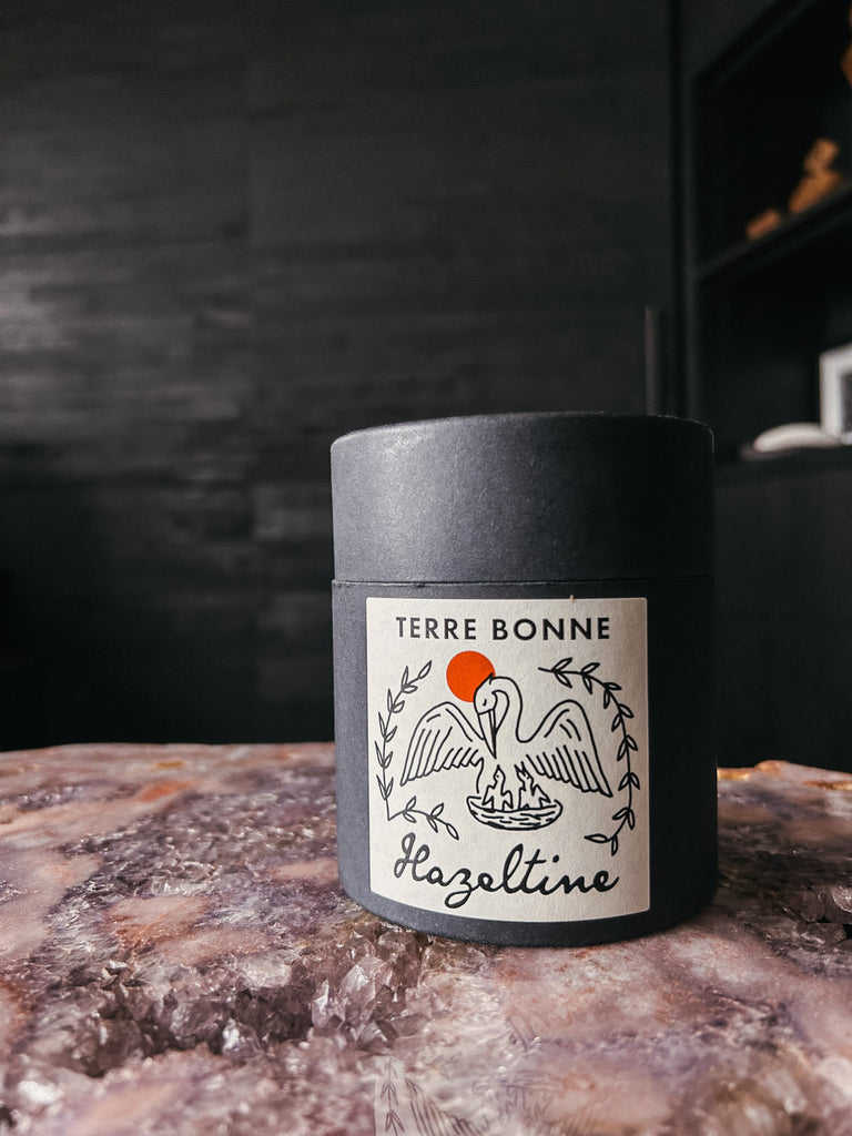 A hand-poured candle inspired by shaded desert sanctuaries, featuring notes of rosewater, fig leaf, cedarwood, and sun-warmed earth.