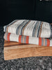 Two colorful Turkish towels displayed together, showing their soft, lightweight cotton texture.