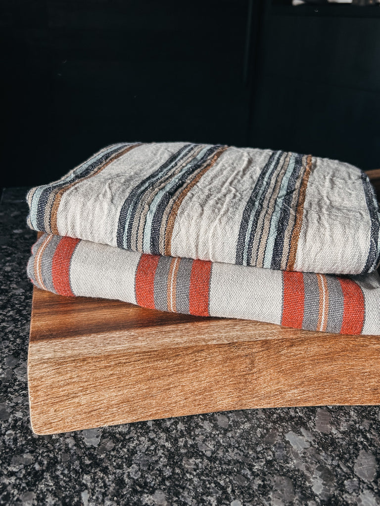 Two colorful Turkish towels displayed together, showing their soft, lightweight cotton texture.