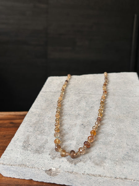 A beautiful necklace made of faceted 3.6-7.6mm Zircon gems in light-filled earthen hues.