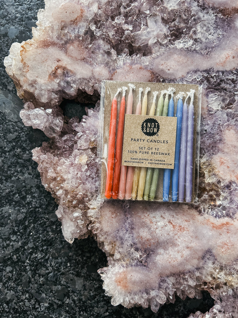 Knot & Bow short rainbow birthday candles in assorted colors.